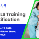 Nursing professionals in scrubs smiling during ALS training certification event.